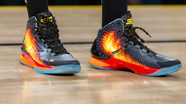 Golden State Warriors guard Stephen Curry's black and blue Under Armour sneakers.